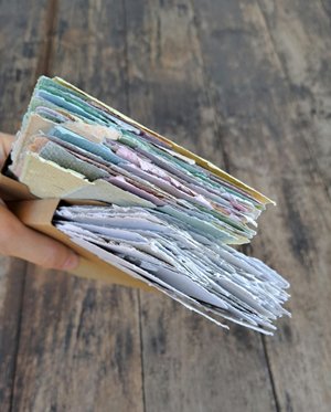Small pouch of mixed handmade paper off-cut strips / pieces for torn paper art / mixed media