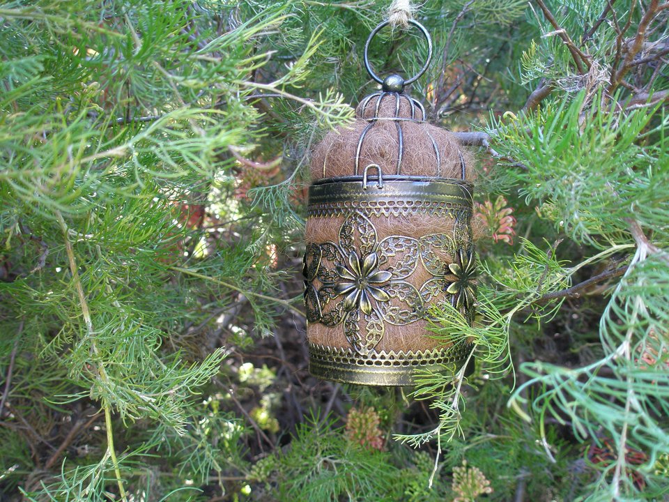 Bird Nester with Llama Fibre. Natural nesting material in decorative metal cage