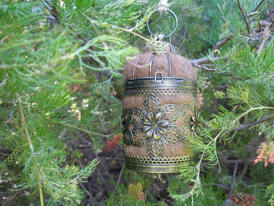 Bird Nester with Llama Fibre. Natural nesting material in decorative metal cage