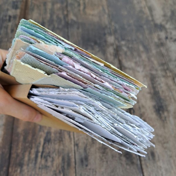 Small pouch of mixed handmade paper off-cut strips / pieces for torn paper art / mixed media